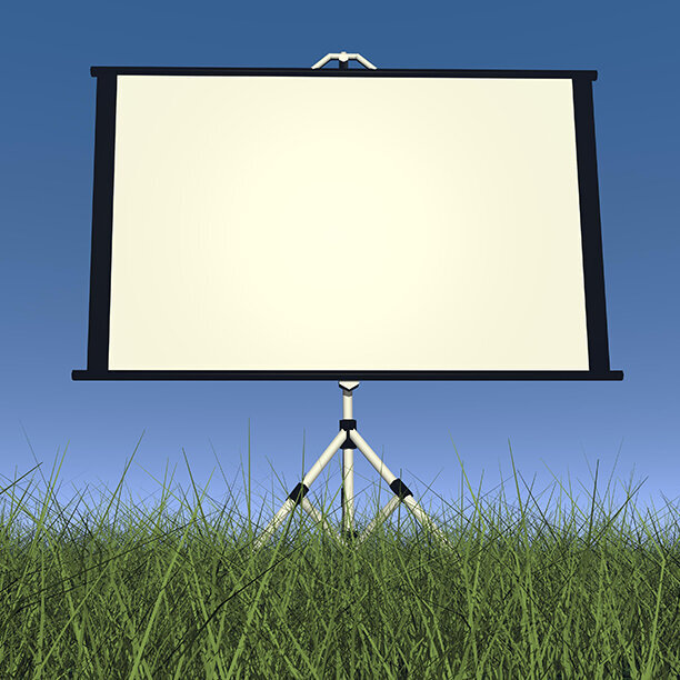 Dia-Leinwand auf Wiese